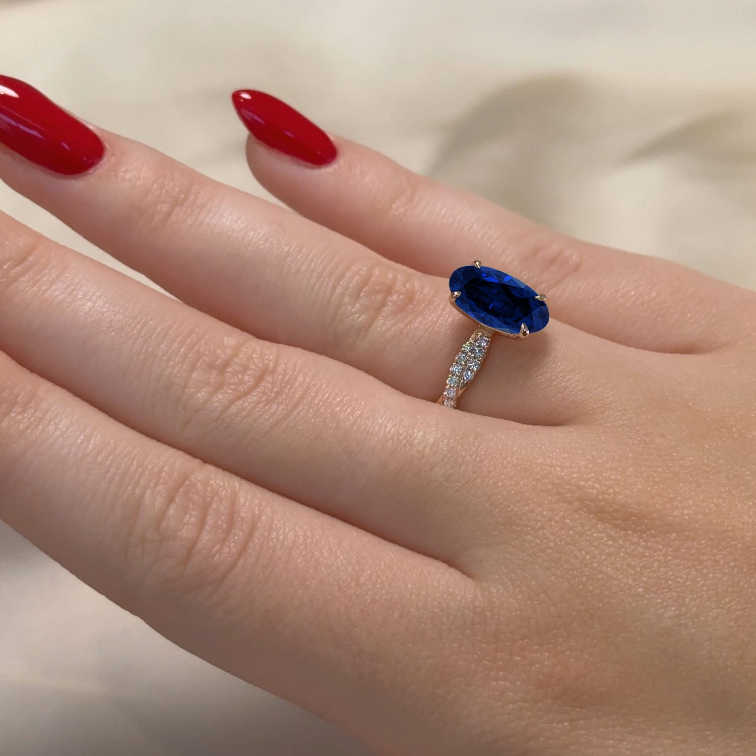 Oval Cut Twisted-Band Blue Sapphire Engagement Ring