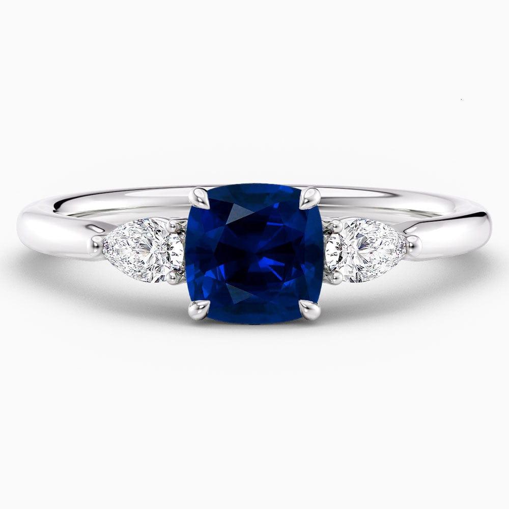 Cushion Cut Three Stone Blue Sapphire Engagement Ring - Featured Image