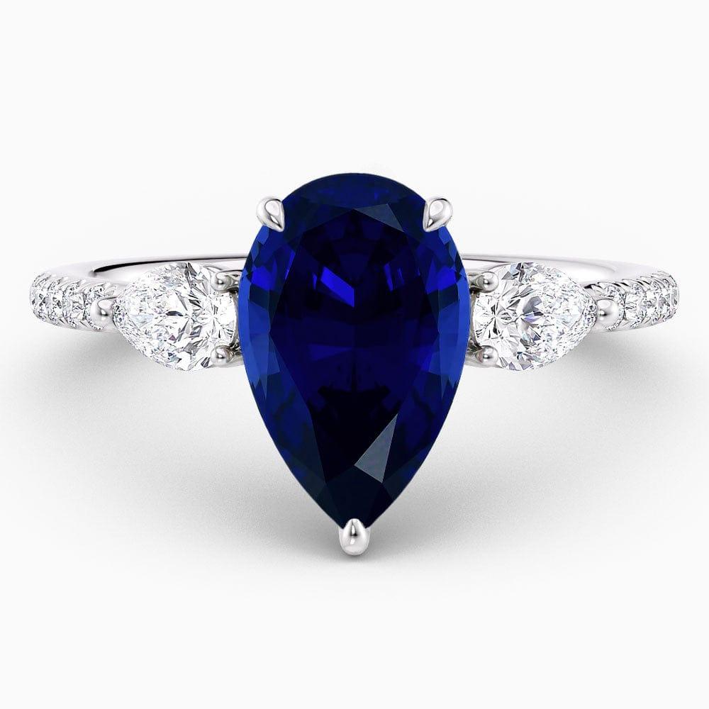 Pear Cut Three Stone Blue Sapphire Engagement Ring - Featured Image