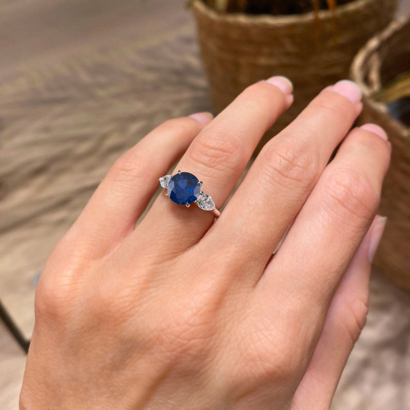 Round Cut Blue Sapphire Three Stone Engagement Ring