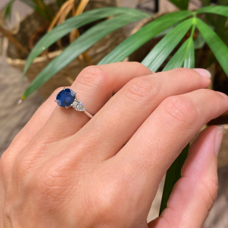 Round Cut Blue Sapphire Three Stone Engagement Ring