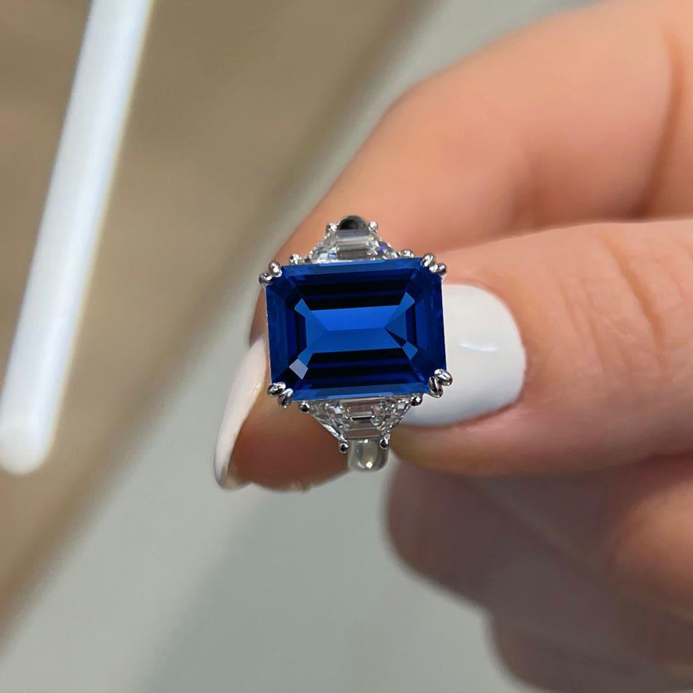 6 Carat Emerald Shape Three Stone Blue Sapphire Engagement Ring - Featured Image