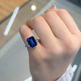 Emerald Cut Blue Sapphire Three Stone Engagement Ring