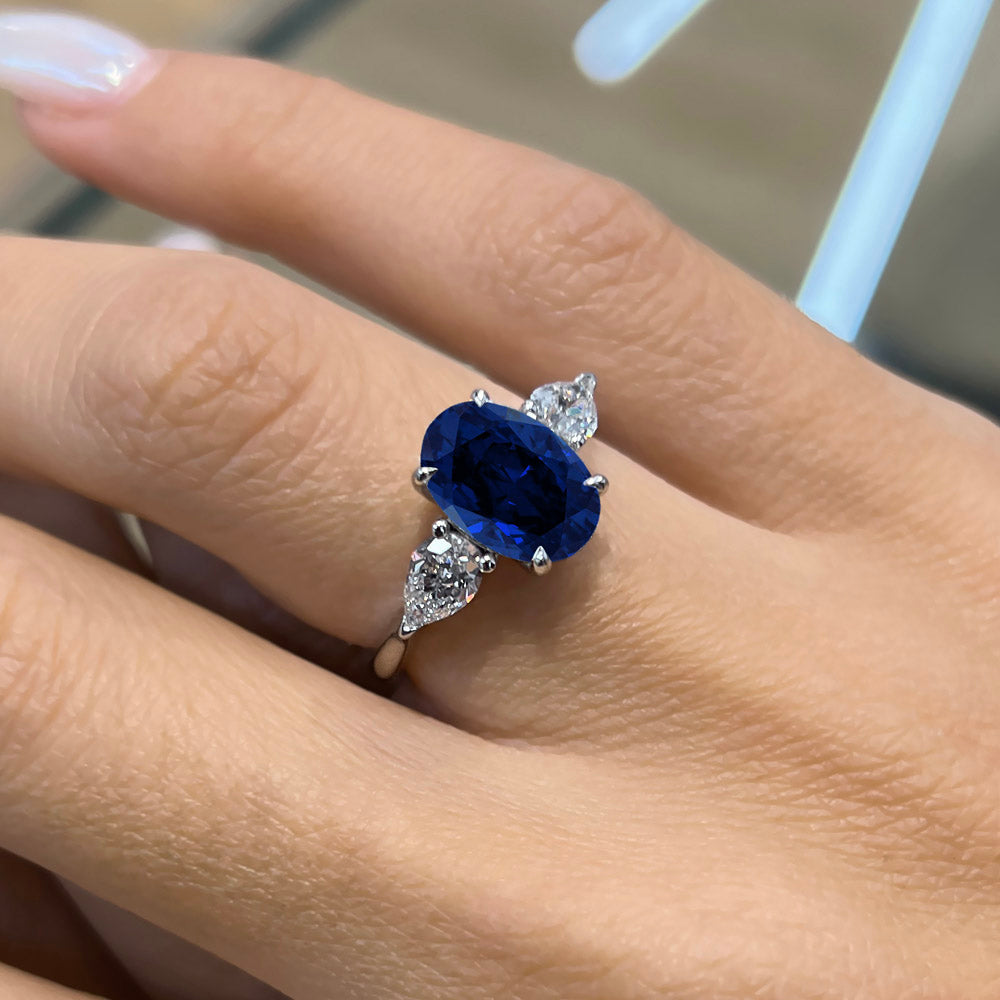 Oval Cut Three Stone Blue Sapphire Engagement Ring