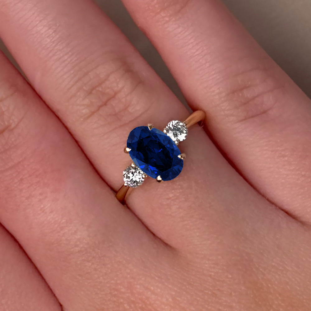 Oval Cut Three Stone Blue Sapphire Engagement Ring