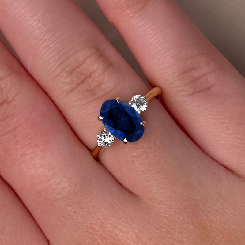 Oval Cut Three Stone Blue Sapphire Engagement Ring