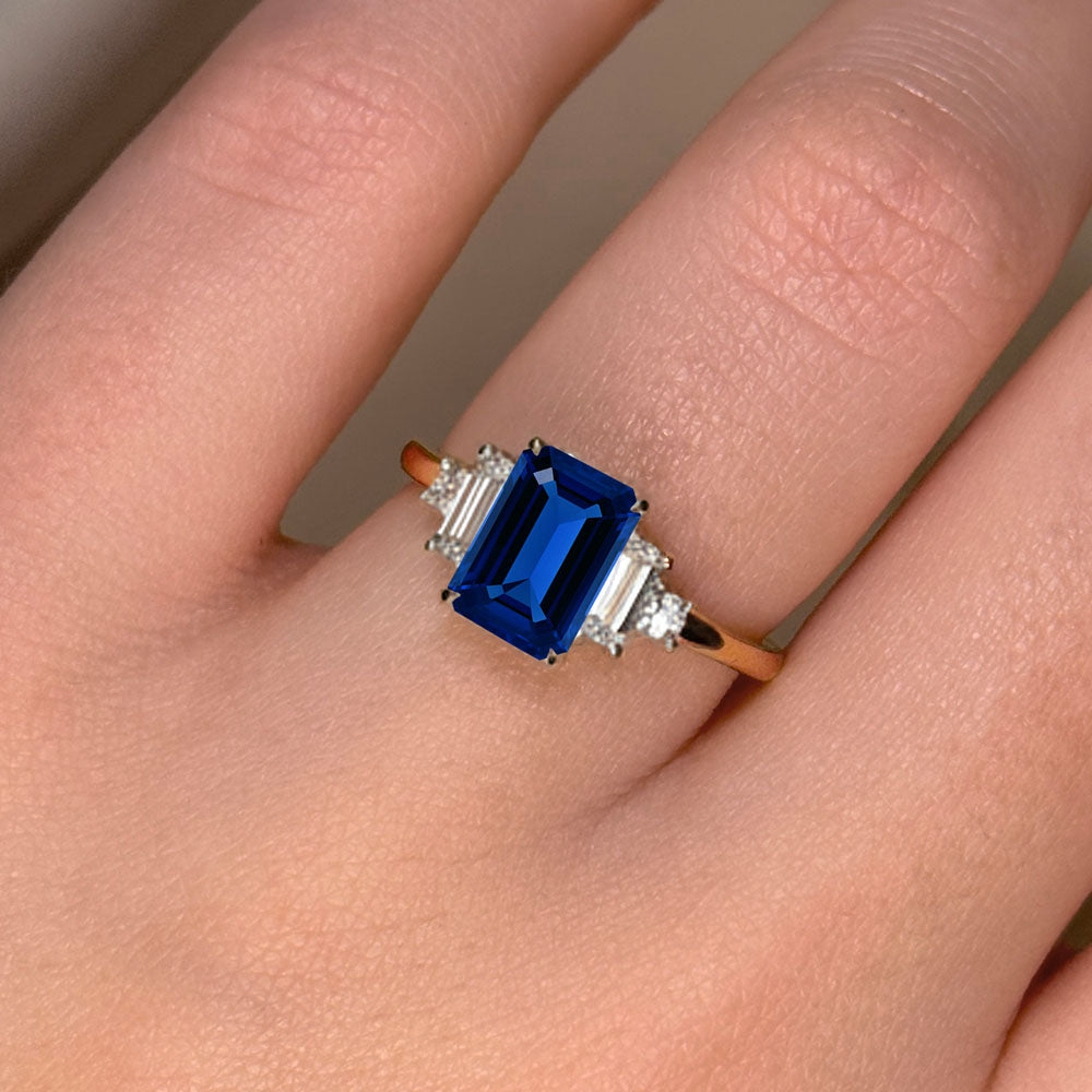 Emerald Cut Three Stone Blue Sapphire Engagement Ring - Featured Image