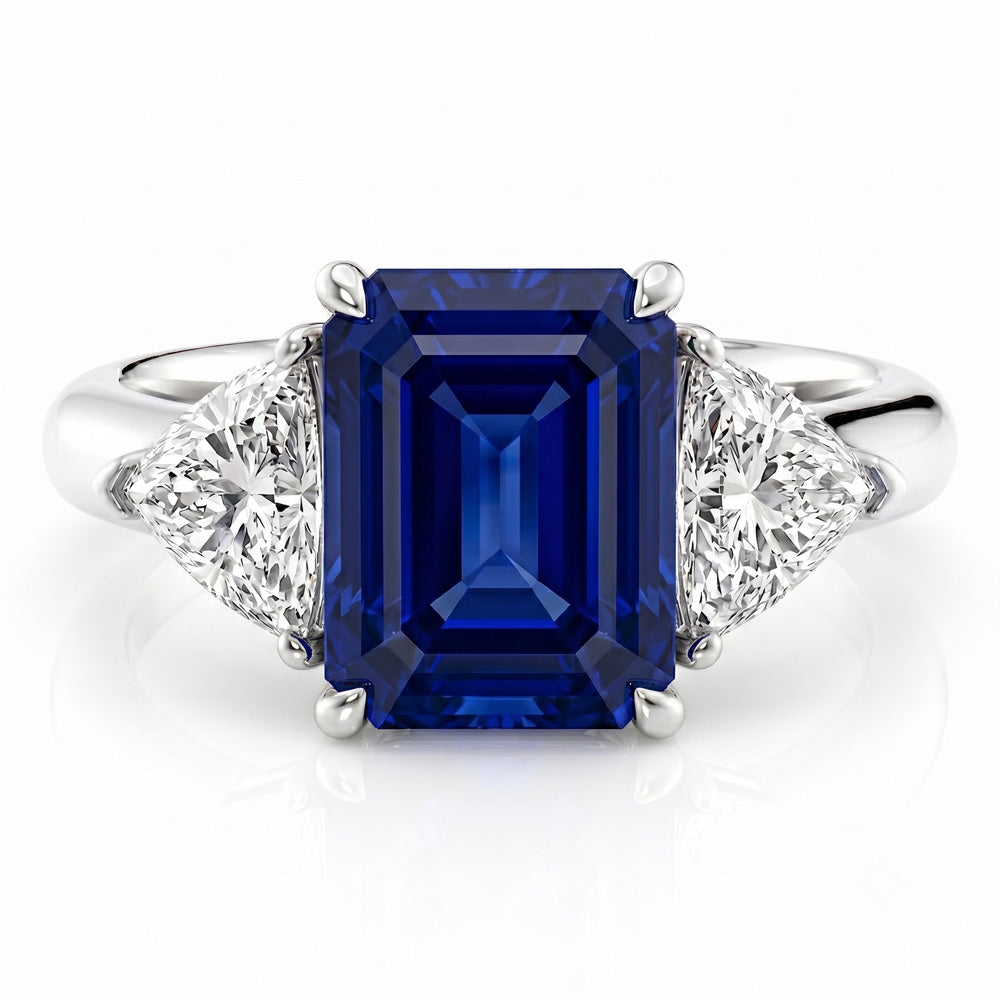 Emerald Cut Three Stone Blue Sapphire Engagement Ring - Featured Image