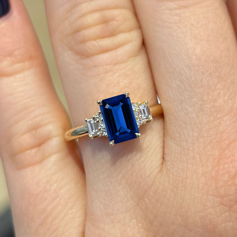 1.80 Carat Emerald Shape Three Stone Blue Sapphire Engagement Ring